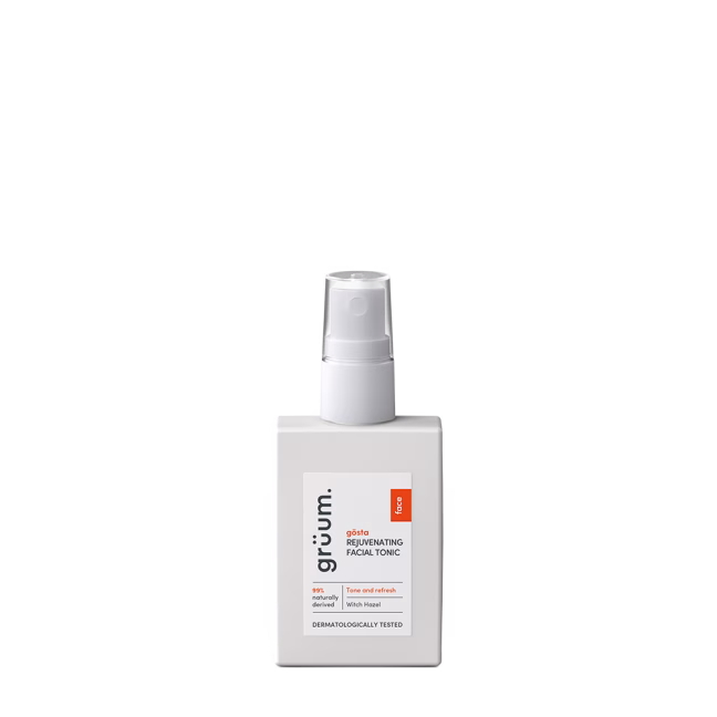 Facial tonic bottle with pump dispenser.