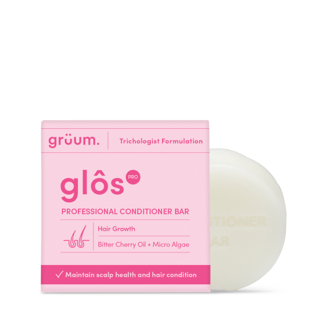 Pink conditioner bar package with white bar.