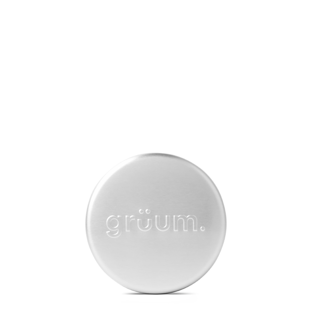 Silver metallic tin labeled groüm.