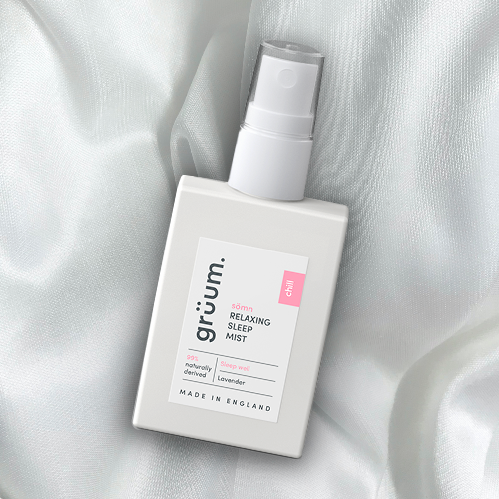 Relaxing sleep mist bottle on fabric