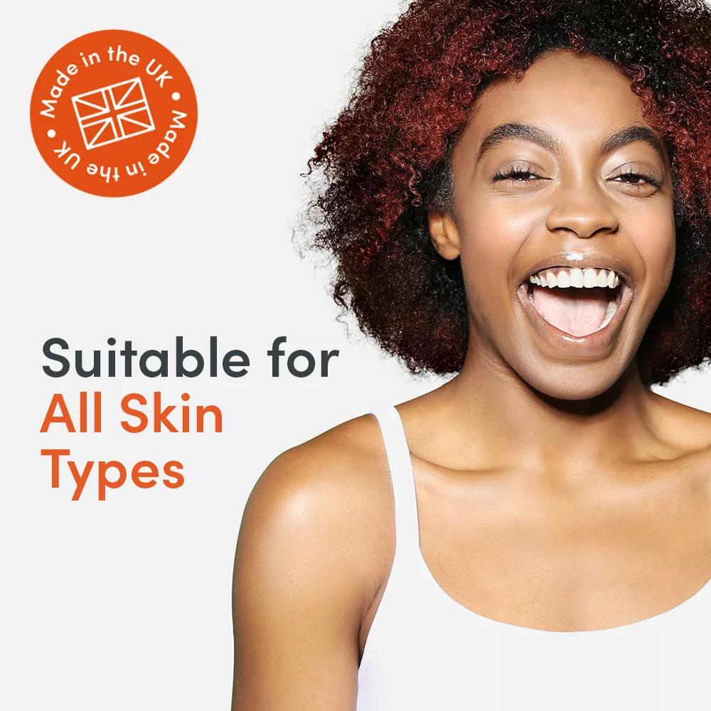 Smiling person with curly hair and text.