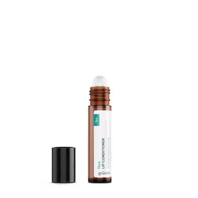 Lip conditioner bottle with cap off.