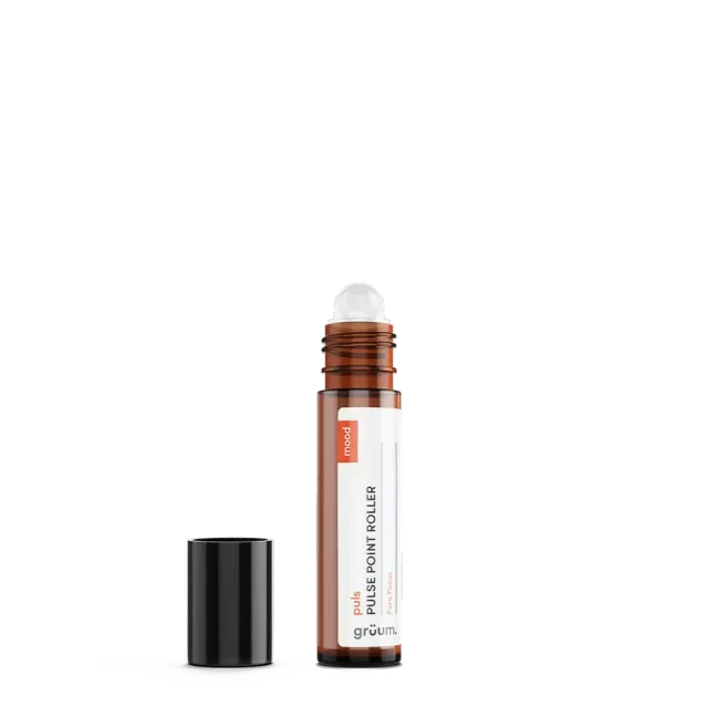 Brown roller bottle with black cap removed.